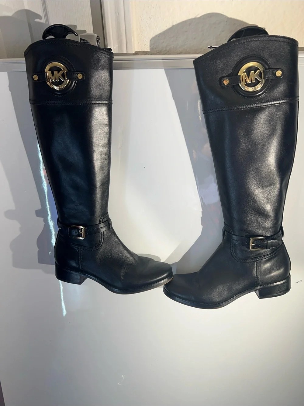 Knee-high leather boots with MK logo